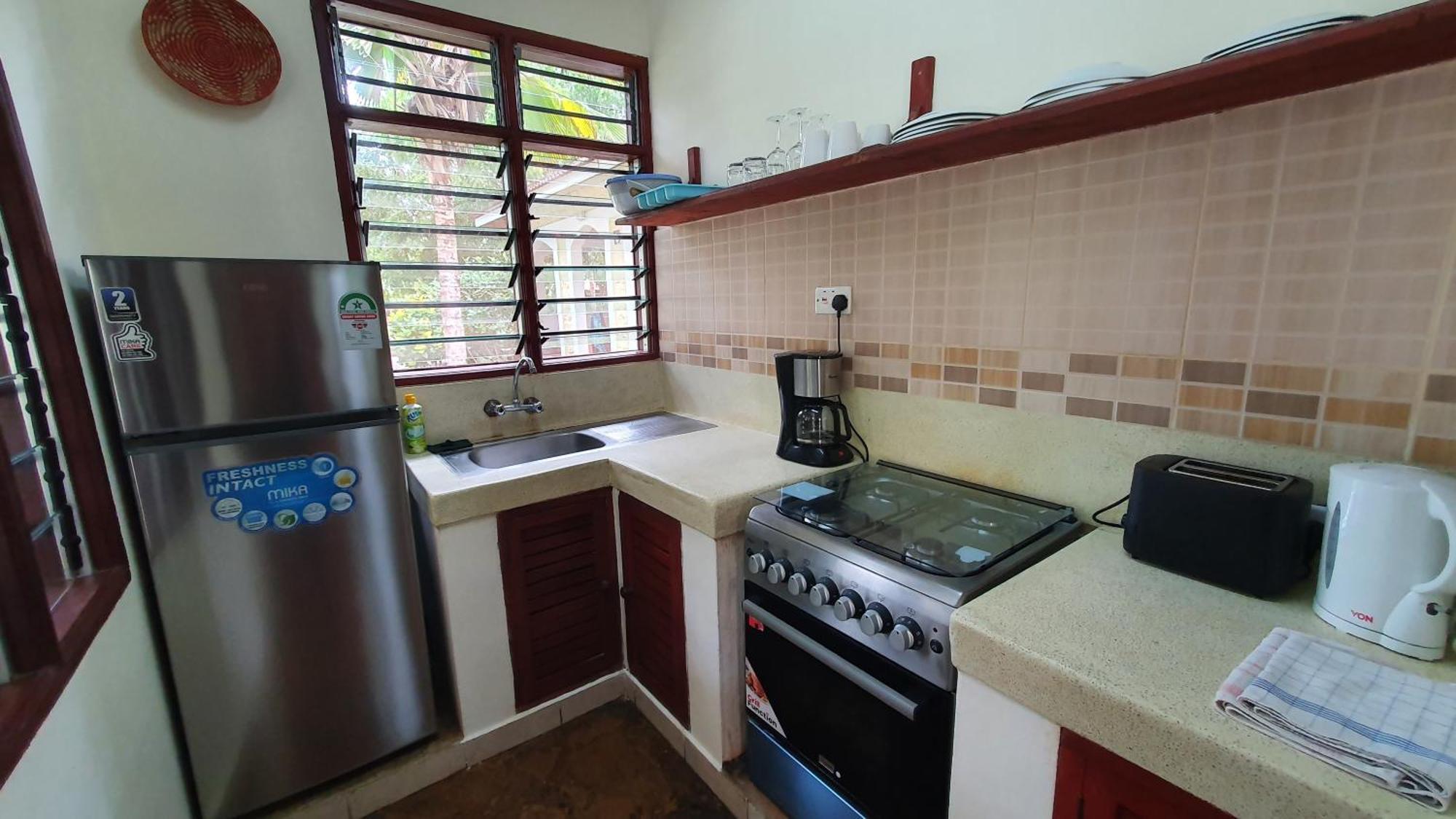 Safina Cottages Diani Beach Esterno foto